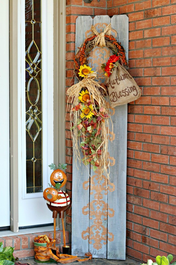 Autumn front porch decor with repurposed fence boards